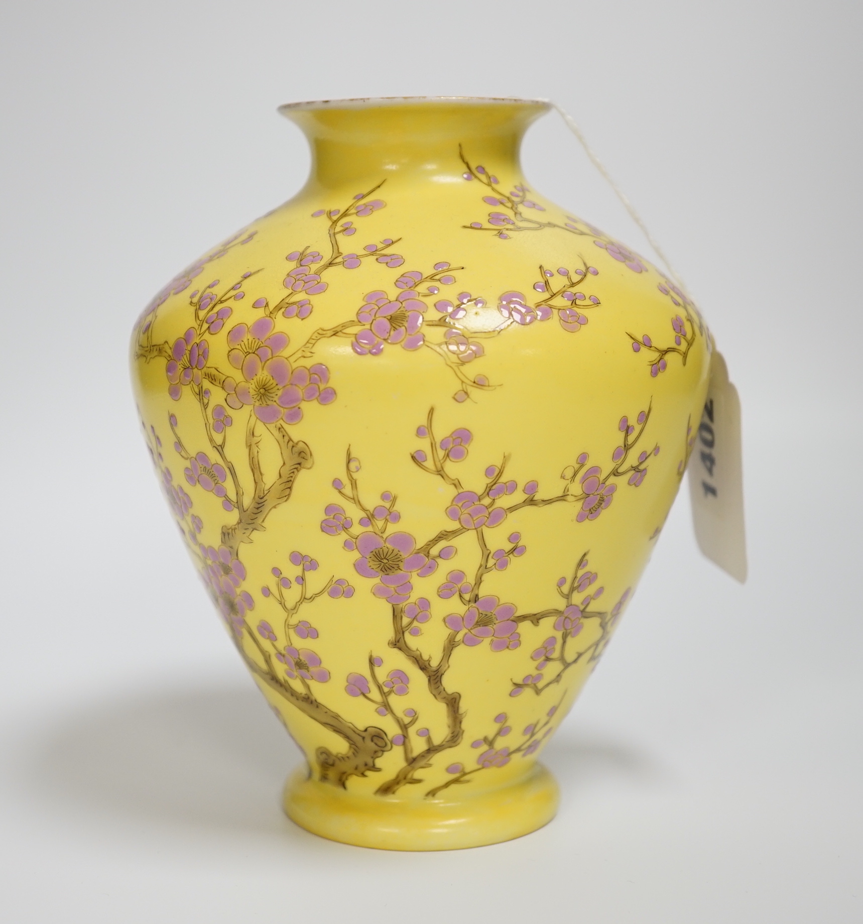 A Japanese yellow ground vase with pink cherry blossom design, 16cm